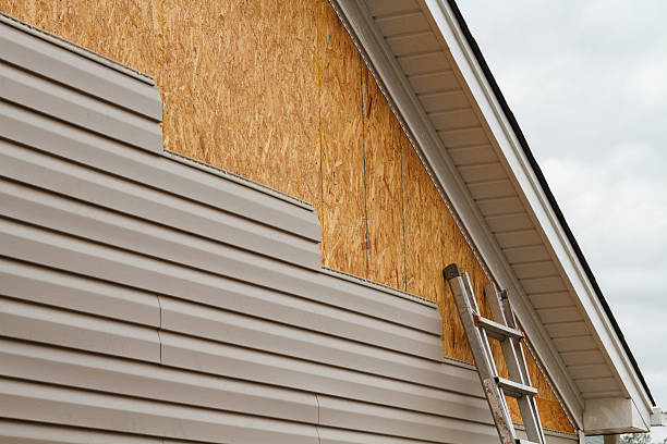 Professional Storm Damage Siding Repair technician working in High Point, NC